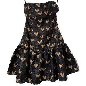 Selling a DELPHINE dress with golden hearts.